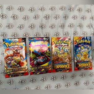 2 Pokemon Mega Evolution Packs and 2 Pokemon Surging Sparks packs. Brand new!